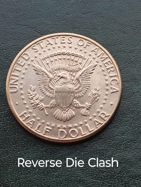 1987 Kennedy half dollar die clash error showing ghost image of reverse eagle design on obverse field